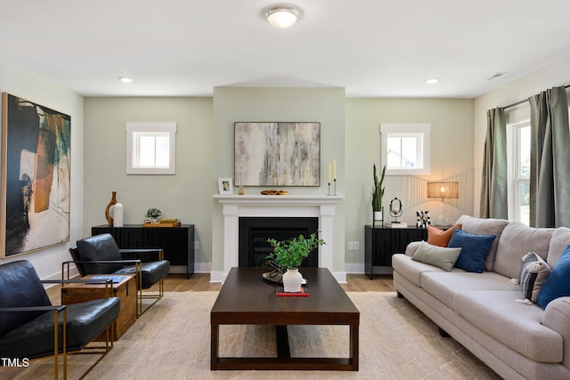 134 Beacon Dr, Pittsboro, NC 27312 - living room with light wood-style flooring, plenty of natural light, a fireplace, and recessed lighting