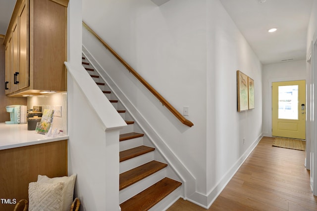 134 Beacon Dr, Pittsboro, NC 27312 - staircase with wood finished floors, baseboards, and recessed lighting