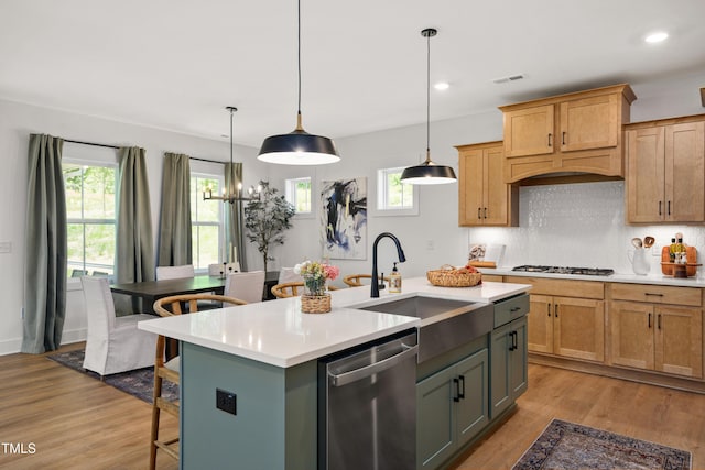 134 Beacon Dr, Pittsboro, NC 27312 - kitchen featuring dishwasher, a sink, gas stovetop, light countertops, and recessed lighting