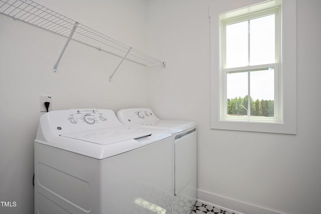 134 Beacon Dr, Pittsboro, NC 27312 - laundry room with washer and dryer, plenty of natural light, and baseboards