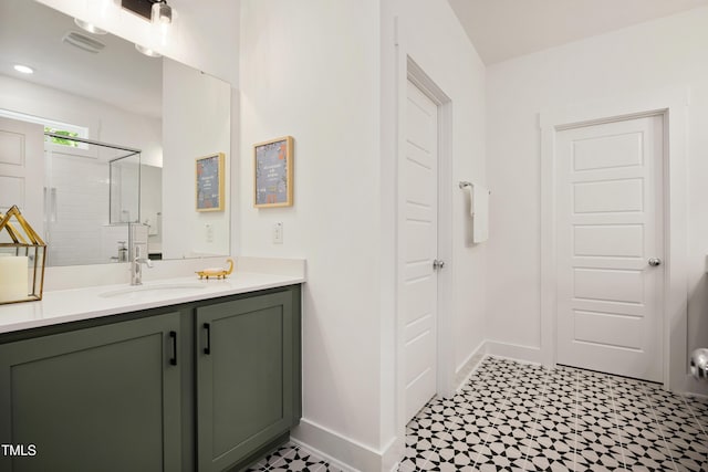 134 Beacon Dr, Pittsboro, NC 27312 - bathroom featuring tile patterned floors, vanity, a stall shower, and baseboards