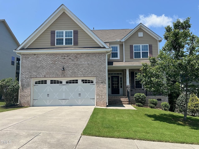 1746 Hammocks Beach Trl, Apex, NC 27502 - view of front of house with a garage, brick siding, a front yard, driveway, and covered porch