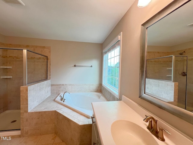 1746 Hammocks Beach Trl, Apex, NC 27502 - bathroom featuring a bath, a stall shower, vanity, and tile patterned floors