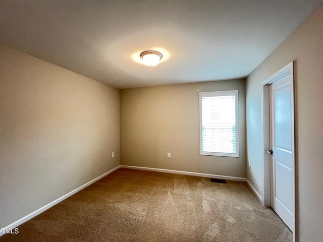 1746 Hammocks Beach Trl, Apex, NC 27502 - empty room featuring carpet and baseboards