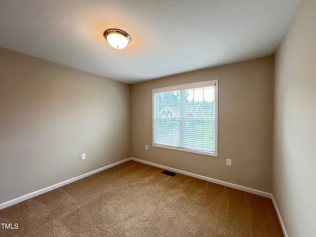 1746 Hammocks Beach Trl, Apex, NC 27502 - unfurnished room with carpet flooring and baseboards