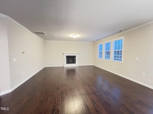1746 Hammocks Beach Trl, Apex, NC 27502 - unfurnished living room featuring dark wood-type flooring, ornamental molding, baseboards, and a glass covered fireplace