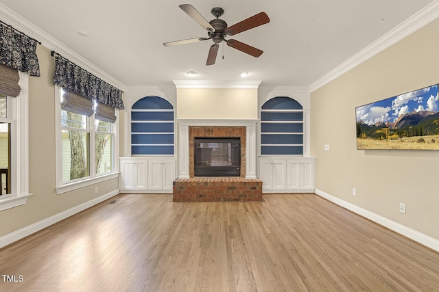 3124 Briar Stream Run, Raleigh, NC 27612 - unfurnished living room featuring wood finished floors, ornamental molding, built in shelves, baseboards, and a brick fireplace