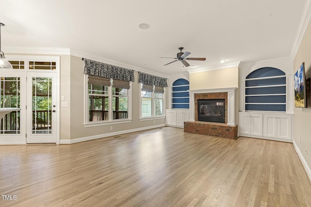 3124 Briar Stream Run, Raleigh, NC 27612 - unfurnished living room featuring ceiling fan, wood finished floors, plenty of natural light, baseboards, and ornamental molding