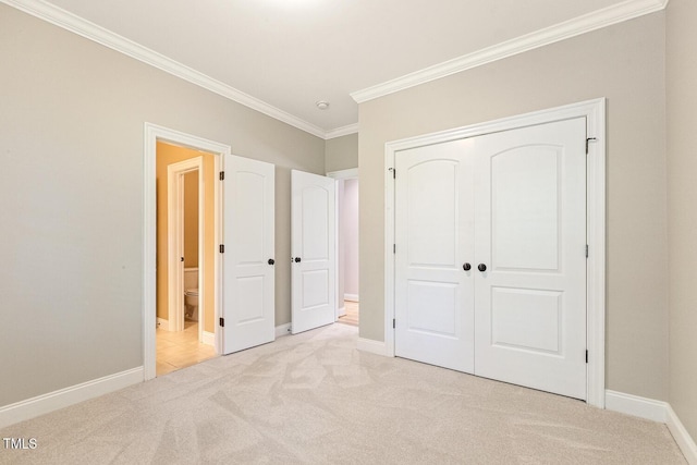 3124 Briar Stream Run, Raleigh, NC 27612 - unfurnished bedroom featuring light carpet, ornamental molding, a closet, baseboards, and connected bathroom