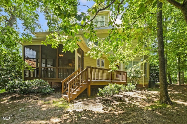 3124 Briar Stream Run, Raleigh, NC 27612 - rear view of house featuring a sunroom and a wooden deck
