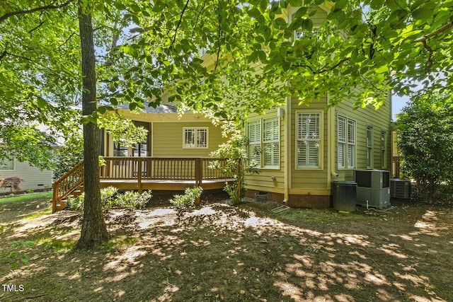 3124 Briar Stream Run, Raleigh, NC 27612 - back of property with a deck, central AC unit, and crawl space