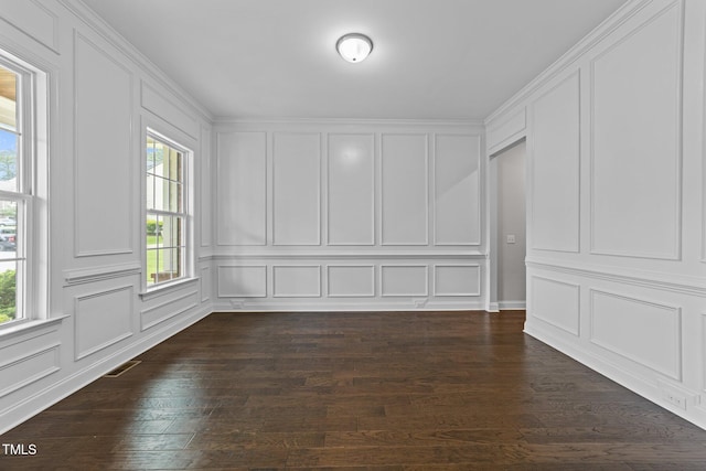 7502 Latteri Ct, Raleigh, NC 27613 - unfurnished room featuring healthy amount of natural light, a decorative wall, and dark wood finished floors