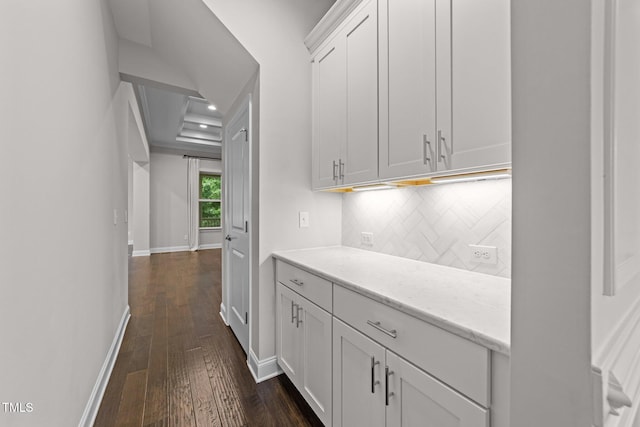 7502 Latteri Ct, Raleigh, NC 27613 - bar featuring dark wood-type flooring and tasteful backsplash