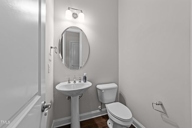 7502 Latteri Ct, Raleigh, NC 27613 - bathroom featuring toilet and wood finished floors