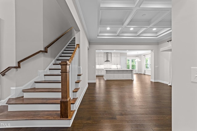 7502 Latteri Ct, Raleigh, NC 27613 - stairway featuring wood-type flooring, recessed lighting, a chandelier, beamed ceiling, and coffered ceiling