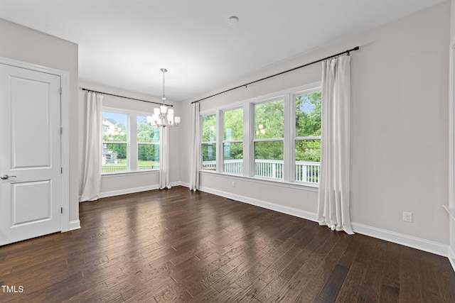 7502 Latteri Ct, Raleigh, NC 27613 - unfurnished dining area with a chandelier and dark wood-style flooring