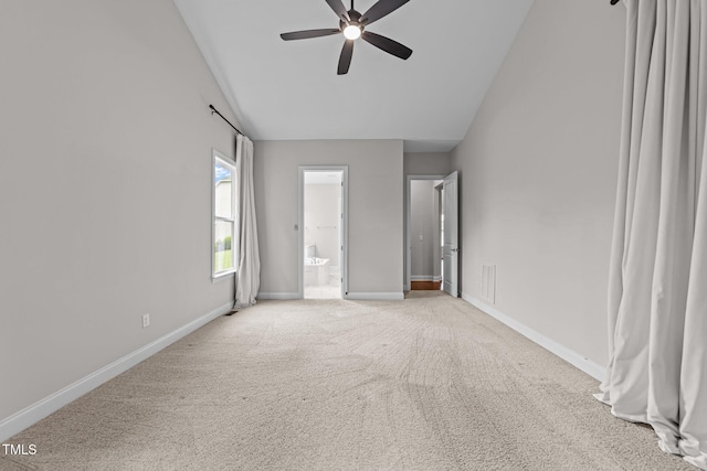 7502 Latteri Ct, Raleigh, NC 27613 - unfurnished bedroom featuring light colored carpet, high vaulted ceiling, connected bathroom, and a ceiling fan