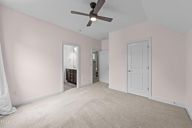 7502 Latteri Ct, Raleigh, NC 27613 - unfurnished bedroom featuring light carpet, ensuite bathroom, ceiling fan, and vaulted ceiling