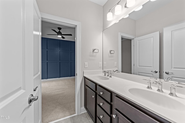 7502 Latteri Ct, Raleigh, NC 27613 - full bath featuring double vanity, ceiling fan, and tile patterned flooring