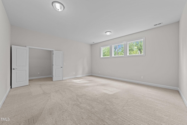 7502 Latteri Ct, Raleigh, NC 27613 - spare room with light carpet and baseboards