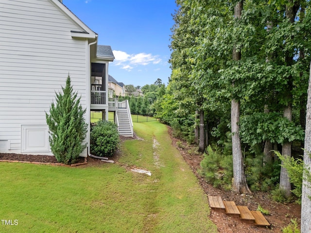 7502 Latteri Ct, Raleigh, NC 27613 - view of green lawn featuring stairway and a sunroom