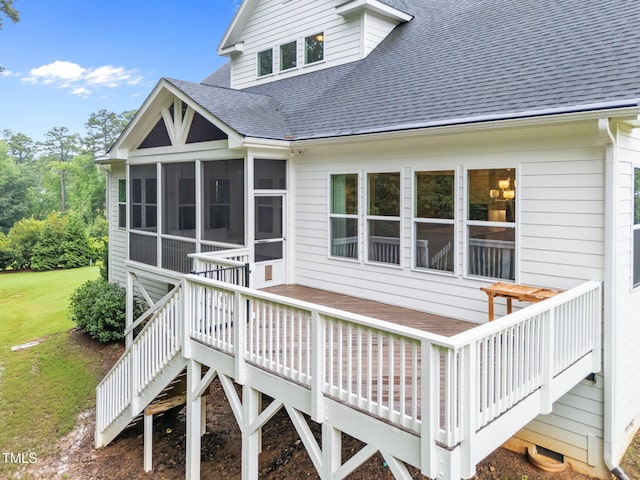 7502 Latteri Ct, Raleigh, NC 27613 - back of house with roof with shingles, a sunroom, a wooden deck, stairs, and a yard