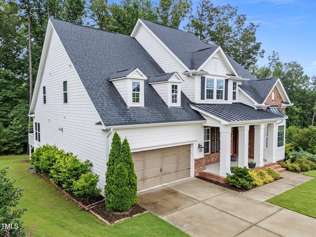 7502 Latteri Ct, Raleigh, NC 27613 - view of front facade featuring a front yard, a garage, concrete driveway, a shingled roof, and brick siding