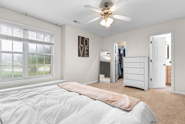 50 Rainwood Ct, Louisburg, NC 27549 - bedroom featuring light colored carpet, baseboards, a walk in closet, and a closet