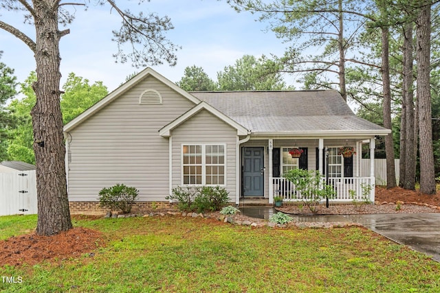 50 Rainwood Ct, Louisburg, NC 27549 - ranch-style home with covered porch and a shingled roof