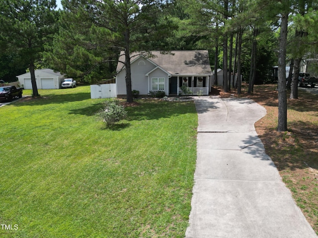 50 Rainwood Ct, Louisburg, NC 27549 - view of front of home with a front lawn, a detached garage, covered porch, and concrete driveway