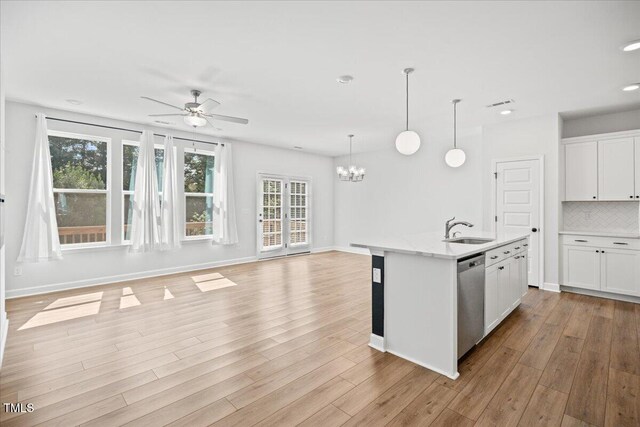 214 George Pine Way, Knightdale, NC 27545 - kitchen featuring a sink, stainless steel dishwasher, a ceiling fan, a chandelier, and open floor plan