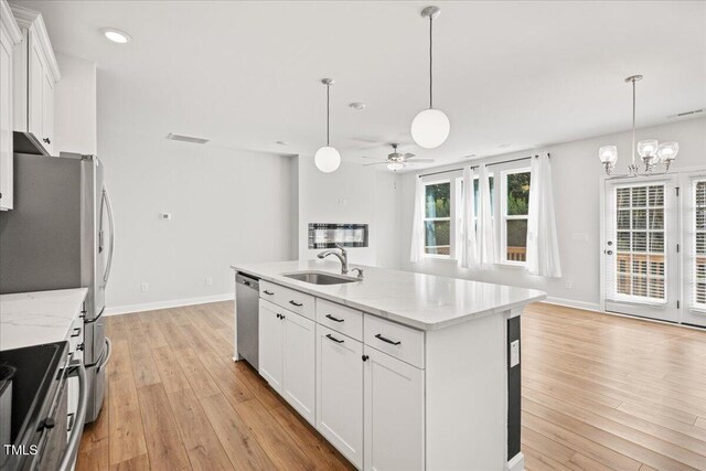 214 George Pine Way, Knightdale, NC 27545 - kitchen featuring a sink, stainless steel appliances, a ceiling fan, light wood-type flooring, and baseboards