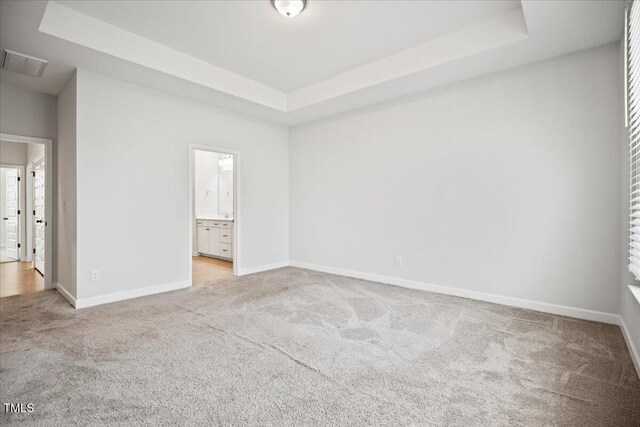 214 George Pine Way, Knightdale, NC 27545 - empty room featuring light carpet, a tray ceiling, and baseboards