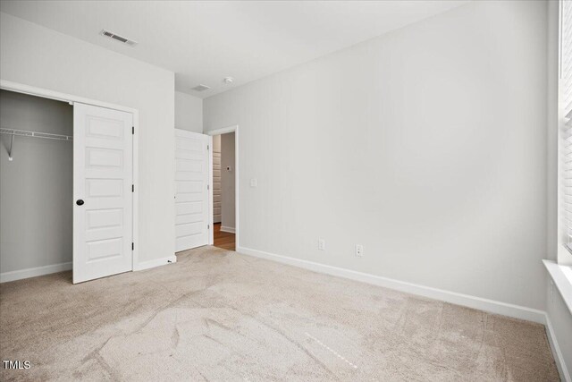 214 George Pine Way, Knightdale, NC 27545 - unfurnished bedroom with carpet, baseboards, and a closet