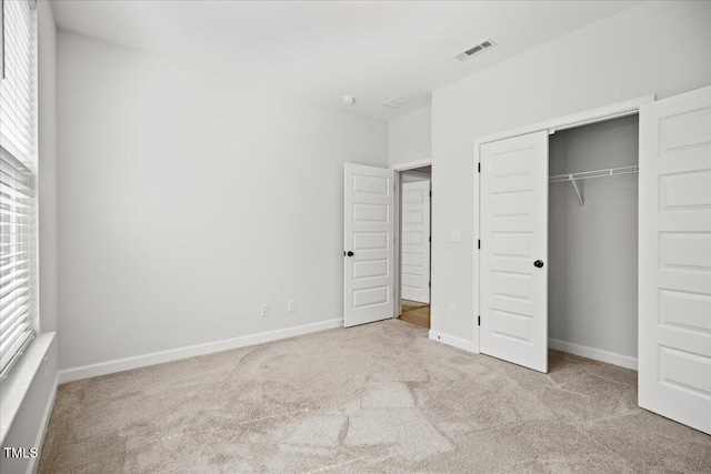 214 George Pine Way, Knightdale, NC 27545 - unfurnished bedroom with carpet, baseboards, and a closet