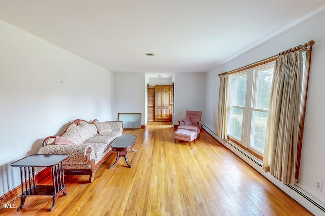 9455 Boston Rd, Roxboro, NC 27574 - living room featuring wood finished floors and baseboard heating