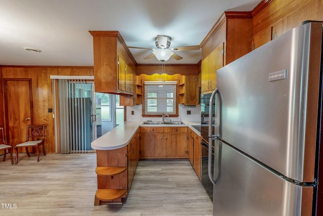 9455 Boston Rd, Roxboro, NC 27574 - kitchen with freestanding refrigerator, open shelves, a sink, light wood finished floors, and ornamental molding