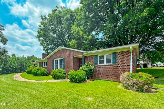 9455 Boston Rd, Roxboro, NC 27574 - ranch-style house featuring brick siding and a front lawn