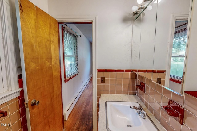 9455 Boston Rd, Roxboro, NC 27574 - bathroom featuring a sink, tile walls, and a wainscoted wall