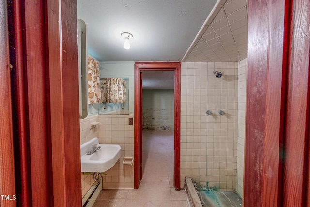 9455 Boston Rd, Roxboro, NC 27574 - bathroom with tile walls, a tile shower, a sink, and baseboard heating