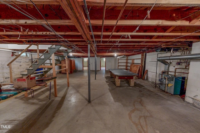 9455 Boston Rd, Roxboro, NC 27574 - unfinished below grade area featuring stairway and a heating unit
