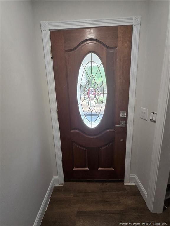 409 Thimbleberry Dr, Vass, NC 28394 - foyer featuring dark wood-style flooring and baseboards