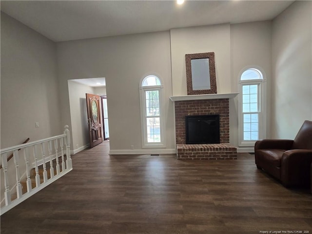 409 Thimbleberry Dr, Vass, NC 28394 - living room with dark wood-style floors, baseboards, a fireplace, and recessed lighting