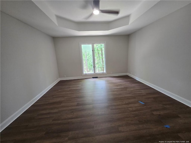 409 Thimbleberry Dr, Vass, NC 28394 - empty room featuring ceiling fan, a raised ceiling, and baseboards