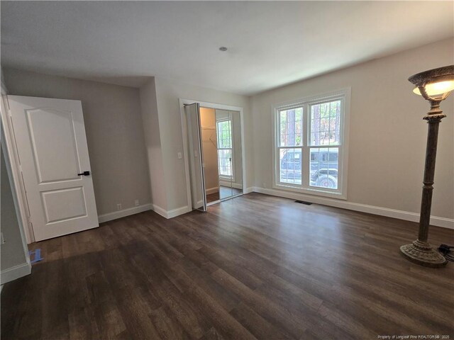 409 Thimbleberry Dr, Vass, NC 28394 - empty room featuring dark wood-type flooring and baseboards