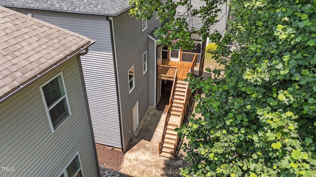 516 Culmore Dr, Fuquay Varina, NC 27526 - view of property exterior featuring stairway, roof with shingles, and a deck
