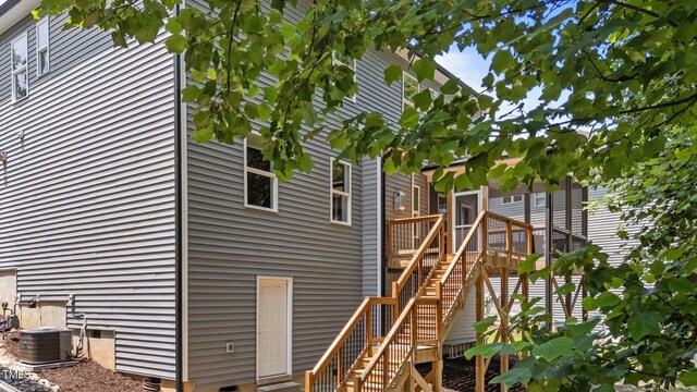 516 Culmore Dr, Fuquay Varina, NC 27526 - view of side of property featuring stairs, central air condition unit, and a deck