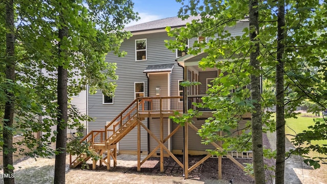 516 Culmore Dr, Fuquay Varina, NC 27526 - rear view of property with stairway, a wooden deck, and roof with shingles
