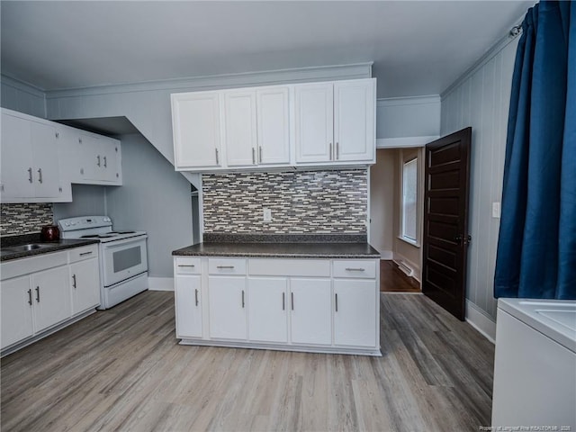 1206 Elm St N, Lumberton, NC 28358 - kitchen featuring white electric range oven, dark countertops, light wood-style flooring, and ornamental molding