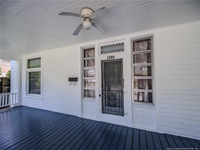 1206 Elm St N, Lumberton, NC 28358 - doorway to property with a ceiling fan, a standing seam roof, covered porch, and metal roof
